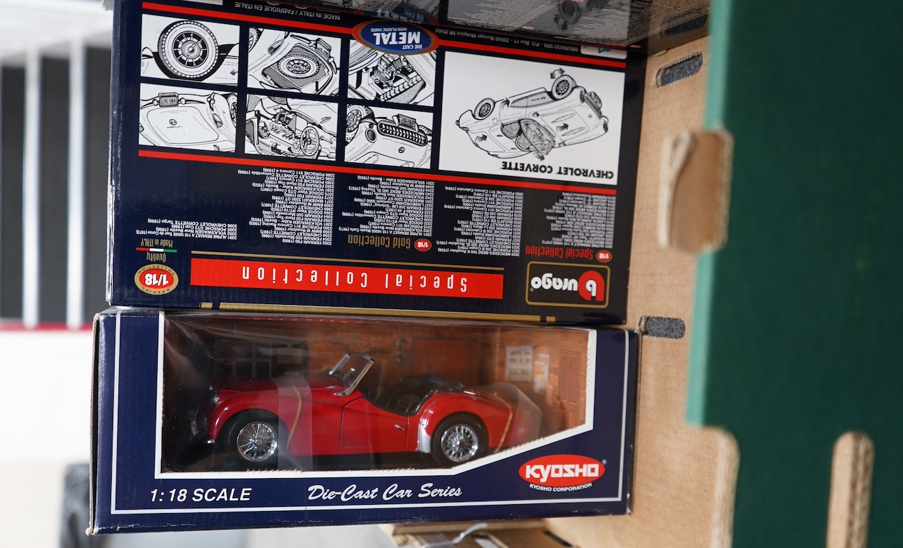 Eight boxed 1:18 scale diecast cars by Bburago, Maisto, etc. including; a Mercedes-Benz 300 SL, an Alpha Romeo 8C 2300 Monza, a Porsche 356B, a Triumph TR3A, etc. Condition - good.